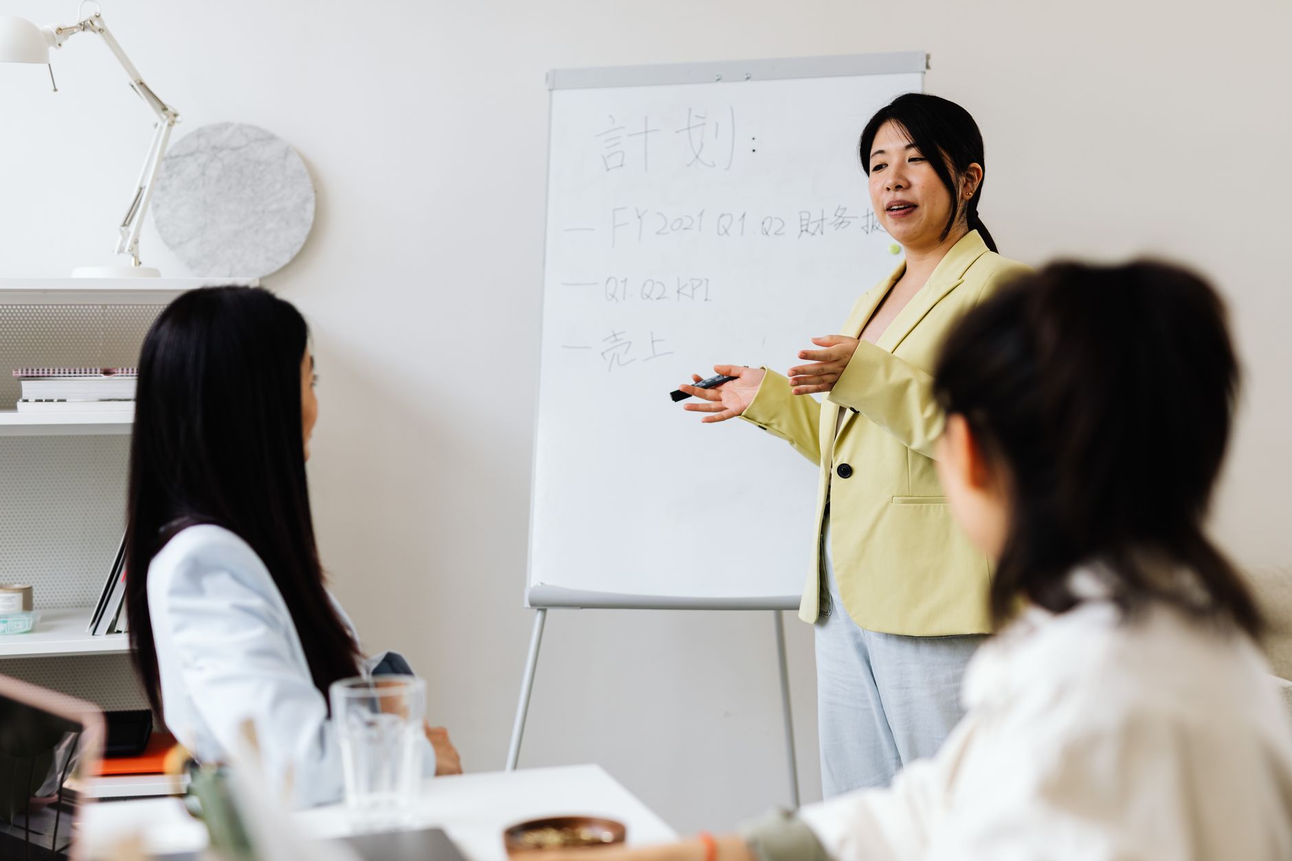 Presentation setup with a colleague presenting strategy to the team