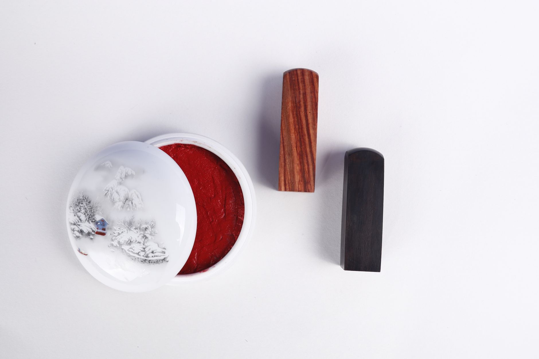 Japanese hanko personal and business seals displayed on a wooden stand