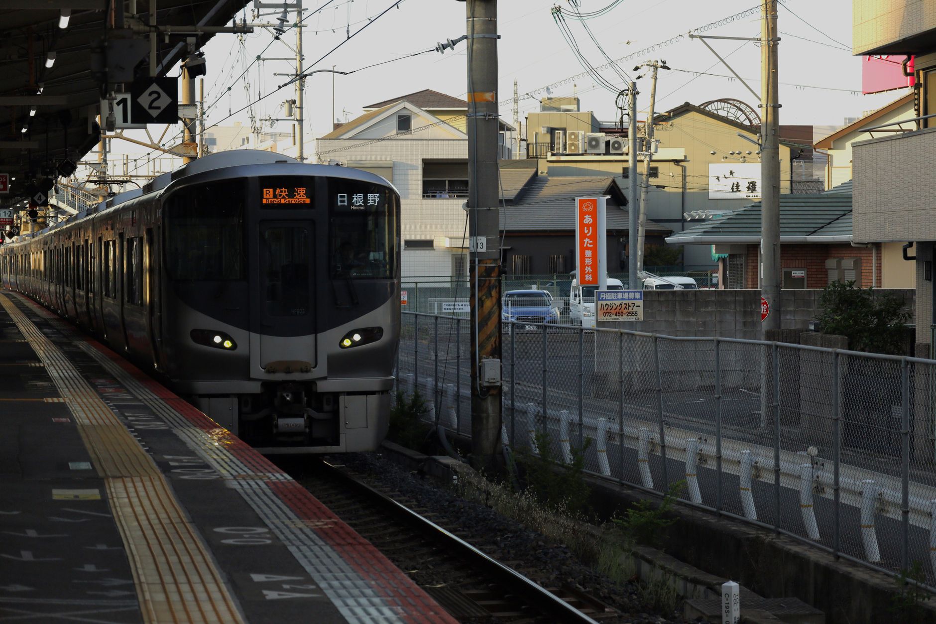Commuter train arriving at a station platform in Japan