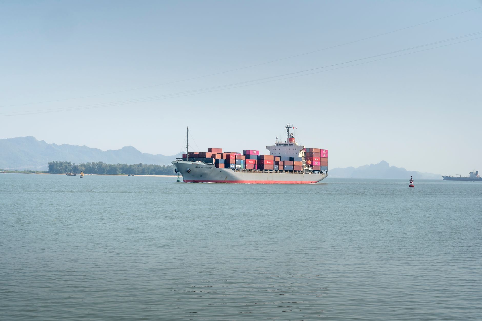 Cargo ship transporting containers across the sea