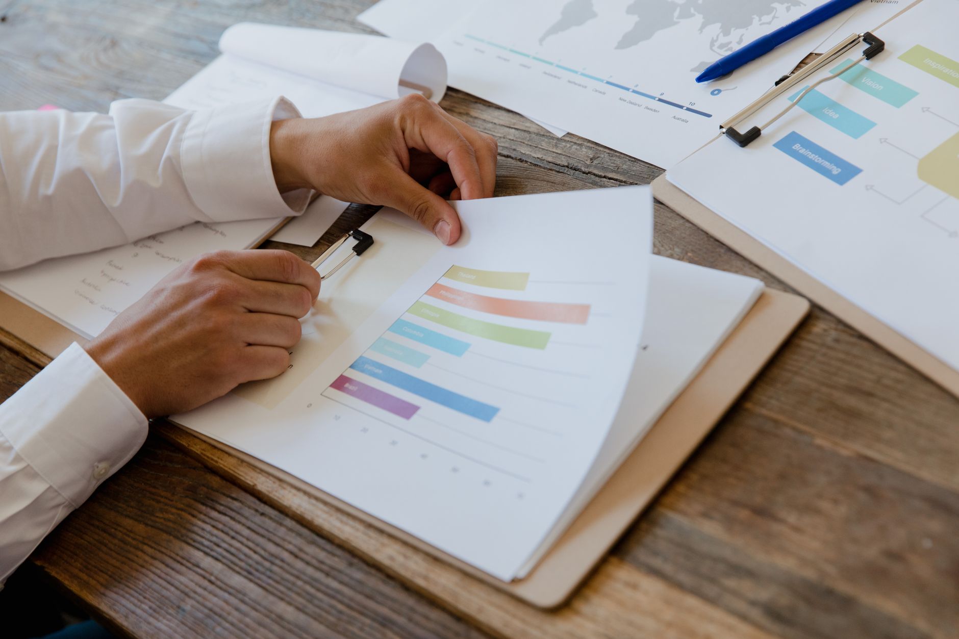 Business data and documents being reviewed on screen, representing the HR record checks made before a Certificate of Employment is issued
